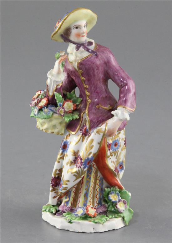 A Bow porcelain figure of a lady seller, c.1765, height 14.6c,